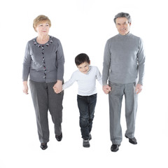 grandma and grandpa go with her grandson.isolated on white background