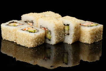 various sushi, rolls on a black background with reflection. especially for cafes and restaurants