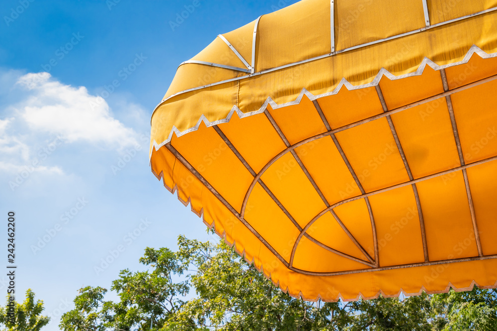 Canvas Prints yellow outdoor awning with blue sky background. exterior shading canvas.