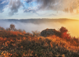 foggy canyon of a picturesque river. foggy autumn morning