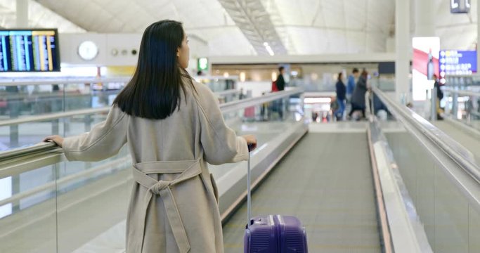 Woman go for the trip in the airport
