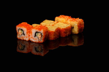 various sushi, rolls on a black background with reflection. especially for cafes and restaurants