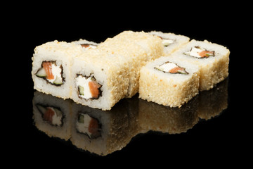 various sushi, rolls on a black background with reflection. especially for cafes and restaurants