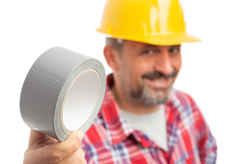 Close-up of duct tape held by constructor.