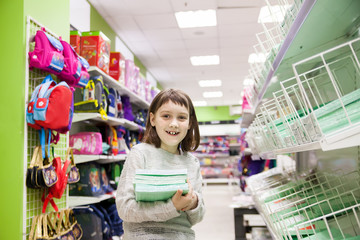 girl choosing office supplies