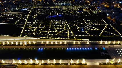 Aerial drone night shot of iconic public settlement of illuminated Stavros Niarchos Foundation and cultural centre during Christmas time, Faliro, Attica, Greece