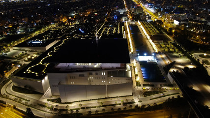 Fototapeta na wymiar Aerial drone night shot of iconic public settlement of illuminated Stavros Niarchos Foundation and cultural centre during Christmas time, Faliro, Attica, Greece