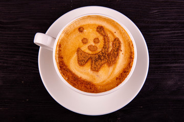 Coffee with the drawing from ground cinnamon