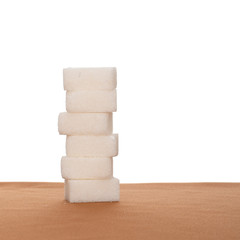 Stack of six sugar cubes on fabric, white background. Daily recommended amount maximum.
