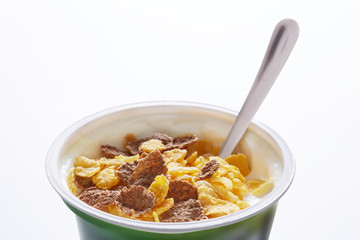 Corn flakes breakfast meal on a white background. 