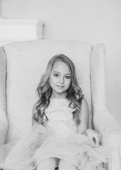 black and white portrait of a charming little girl in a dress