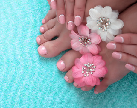 Beautiful Pink Manicure And Pedicure With Flowers