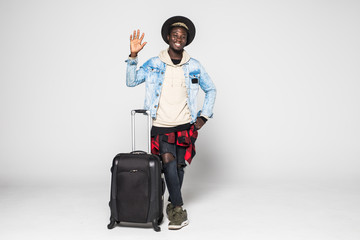 Full body of African american business man traveling with suitcases showing an ok sign with fingers. Face of happiness and satisfaction on white background