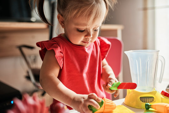 Little girl playing at home