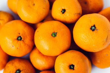 Fresh whole mandarin oranges background , top view.