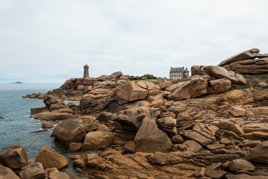 Maison Gustave Eiffel with lighthouse and granite rocks, Phare de Ploumanac'h or Phare de Mean Ruz, Cote de Granit Rose, Ploumanach, Brittany, France, Europe