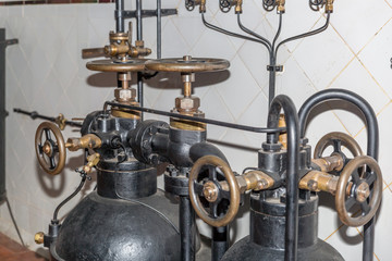 Fototapeta na wymiar Control valves in an old subway machine room