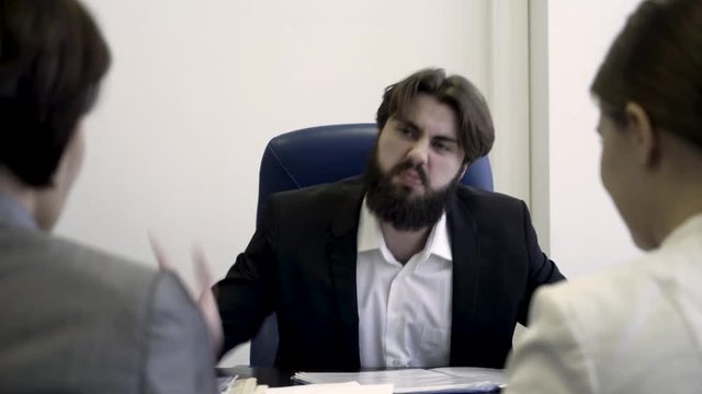 Angry boss scolding, criticizing stressed women for incompetence, women discrimination and sexism concept. Sad, frustrated employee receive unfair reprimands, suffer from bad attitude of executive.