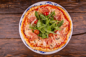 Champignons pizza and Parma with arugula