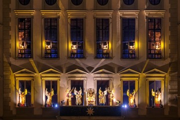 Illuminated angelic play at the town hall by night, Christmas market, Augsburg, Swabia, Bavaria, Germany, Europe
