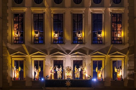 Illuminated angelic play at the town hall by night, Christmas market, Augsburg, Swabia, Bavaria, Germany, Europe