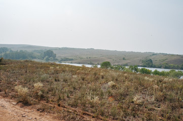 Freshwater reservoir in the Luhansk steppes in Ukraine. Summertime landscape panorama of region of Ukraine near to Russia