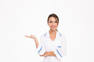Beautiful young woman doctor wearing uniform