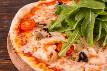Mussels, shrimps, cheese, arugula, cherry tomatoes, barbecue sauce