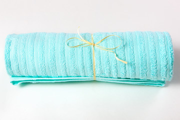 towel twisted by a straw on a white background