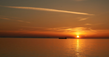 The silhouette of the ship at sunset