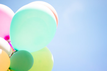 Group of soft pastel balloon with colorful on light blue sky. Concept of wedding, love, party and happy day. Use for background and greeting card.