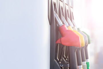 Colorful Petrol pump filling on white background , Gas station in a service in sunset,copy space