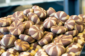 Round cookies strips of white and brown dough.