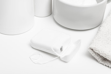 White dental floss on bathroom table