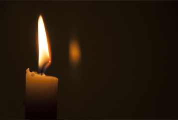 Candle flame on a dark background