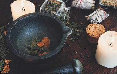Kitchen witchery - making magickal spice blend for a spell. Dried herbs and spices mixed in mortar...