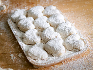 Raw homemade bread or donut in try on table.