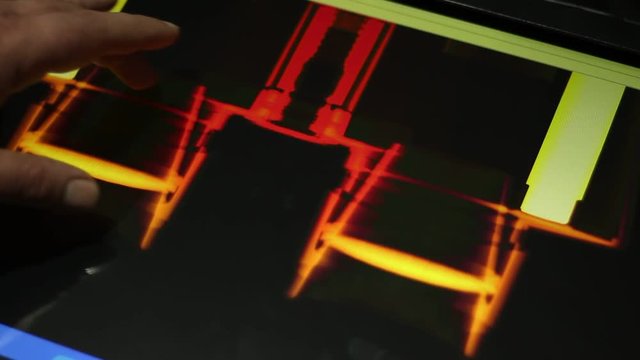 Close up video as hand examines colored image of the binoculars. Binoculars or field glasses are two telescopes mounted side-by-side and aligned to point in the same direction.