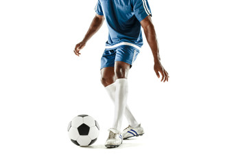 The legs of soccer player close-up isolated on white. African american model in action or movement with ball. The football, game, sport, player, athlete, competition concept