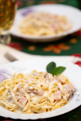 Tagliatelle pasta with cream, meat and mushrooms