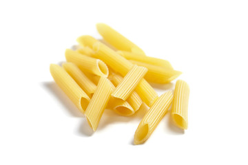 Uncooked Penne Rigate Italian Pasta, isolated on white background
