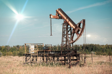 abandoned pump jack on an abandoned oil field