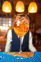 Bartender preparing alcoholic aperitif, aperol spritz cocktail