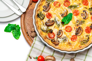 Baked homemade quiche pie in ceramic baking form
