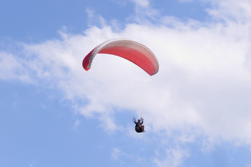 Paraglider floating in the air against the sky. Close-up / Parachute close-up