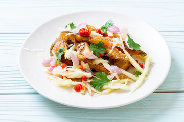 crispy gourami fish with spicy salad