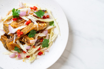 crispy gourami fish with spicy salad