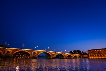 Fototapeta na wymiar Reflection of Pont Neuf lights at Garonne river