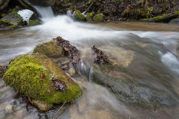 flowing water in the stream - 242496017