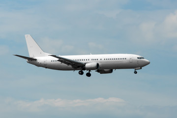 Civilian twin-engine airplane landing at international airport